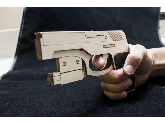 Gun with rubber band and laser red dots - Dezin